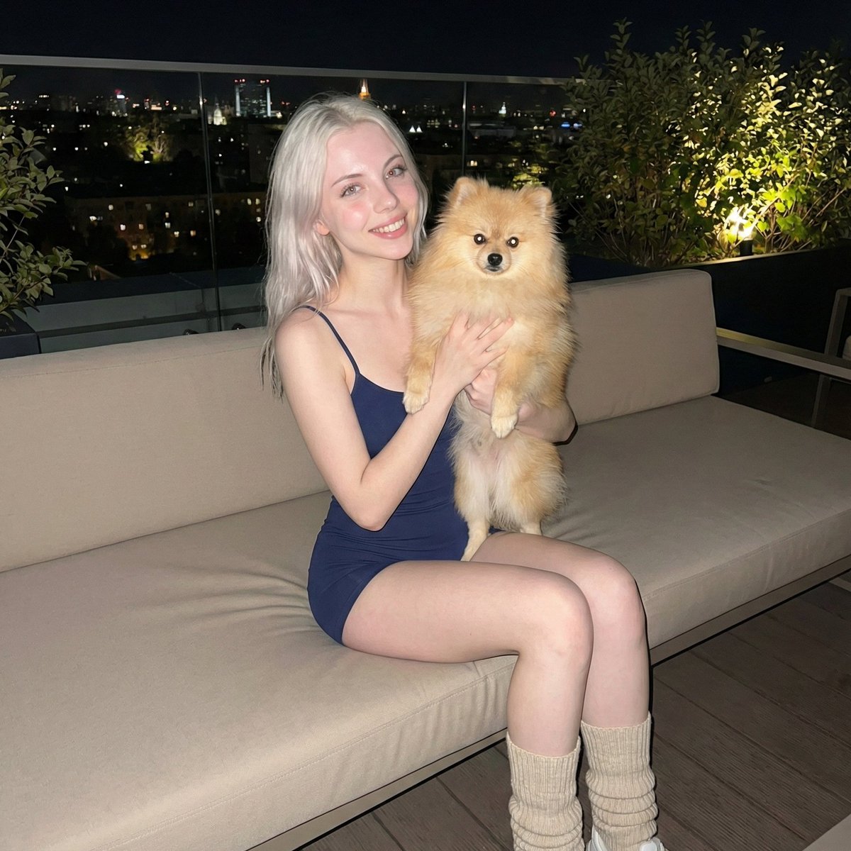 Social Media Post - Photorealistic Portrait of Woman Holding a Pomeranian (iPhone Style) — output 1