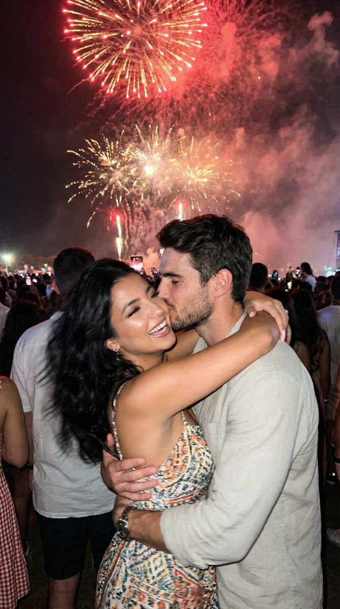 Social Media Post - Candid Smartphone Snapshot of Festival Kiss with Fireworks — output 1