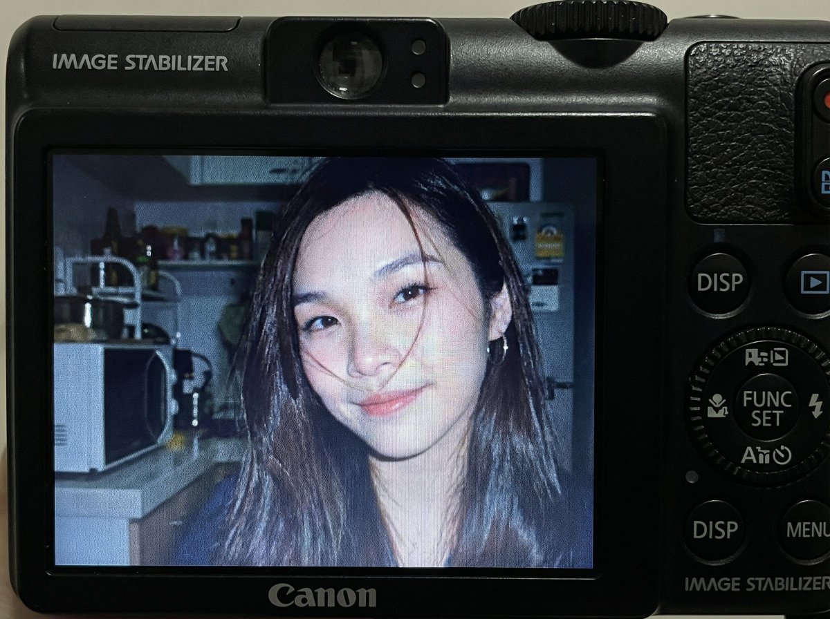 Compact Digital Camera Screen Snapshot of a Young Woman — output 1