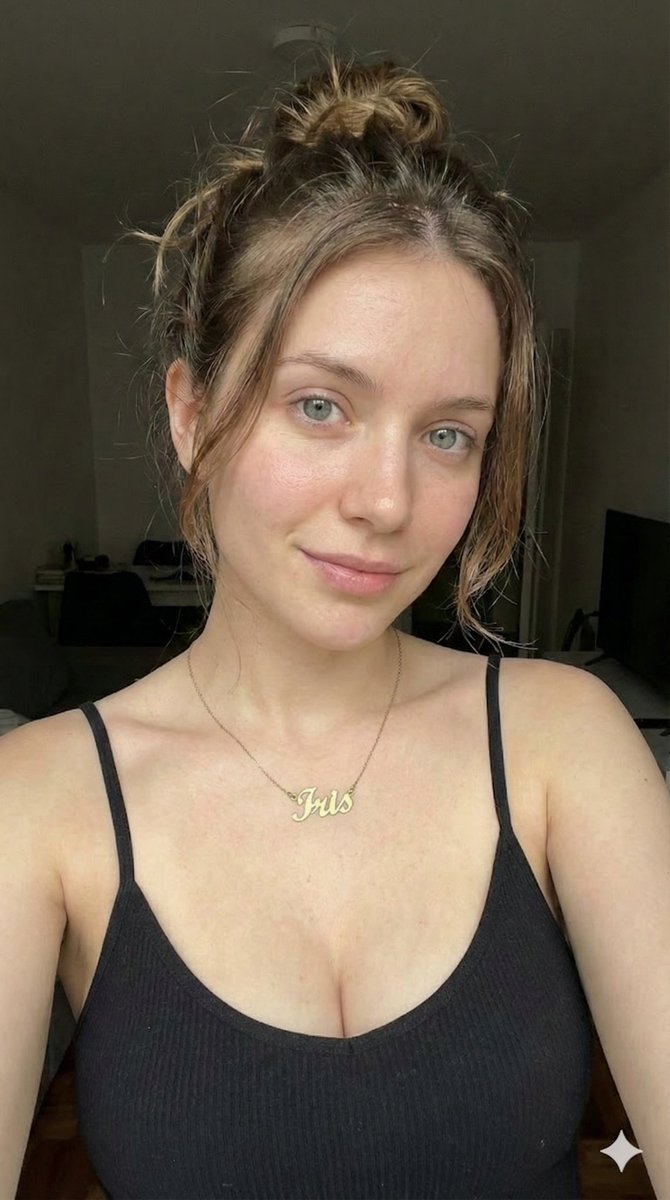 Profile / Avatar - Low-Key Close-up Portrait with Nameplate Necklace — output 1