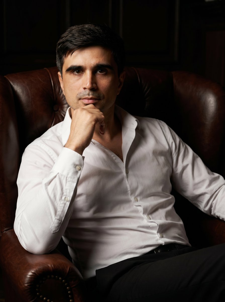 Profile / Avatar - Professional Executive Portrait in Armchair — output 1