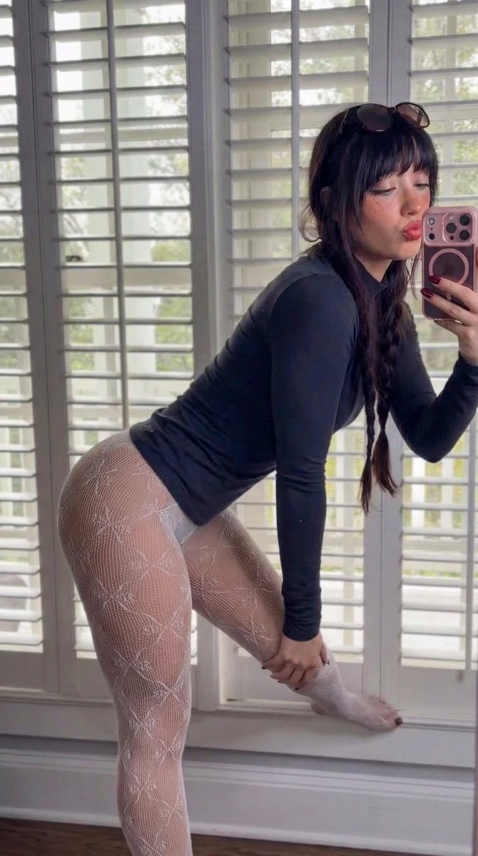 Photorealistic Side-Angle Mirror Selfie with Backlighting — output 1