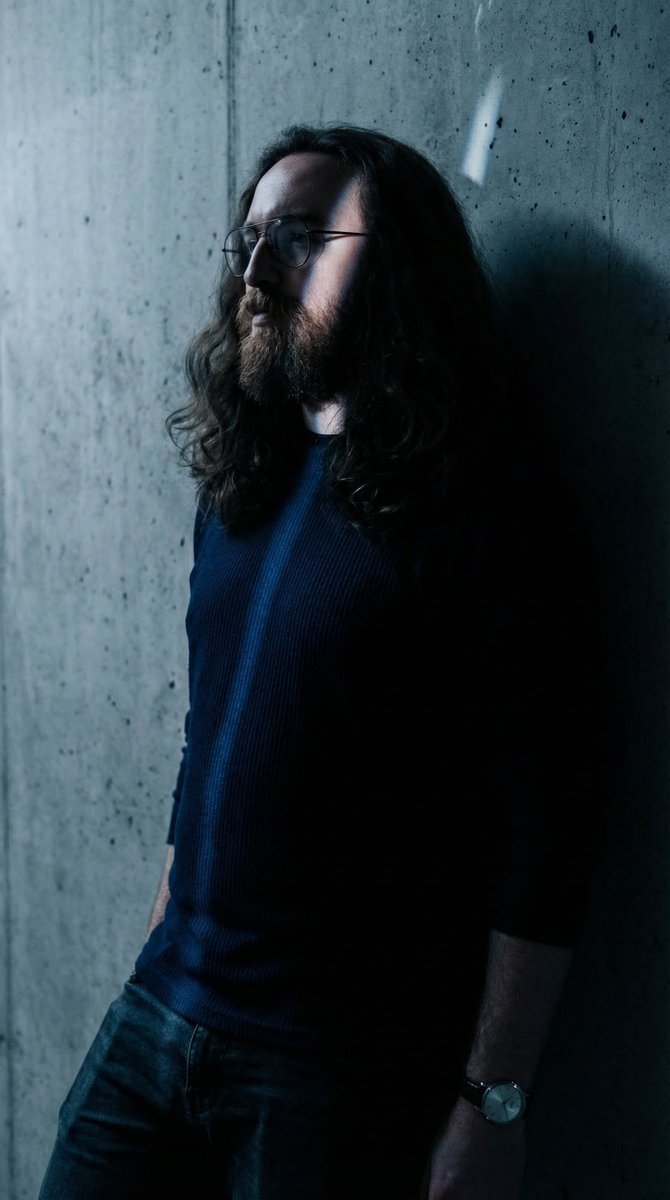 Moody High-Contrast Portrait with Rim Light — output 1