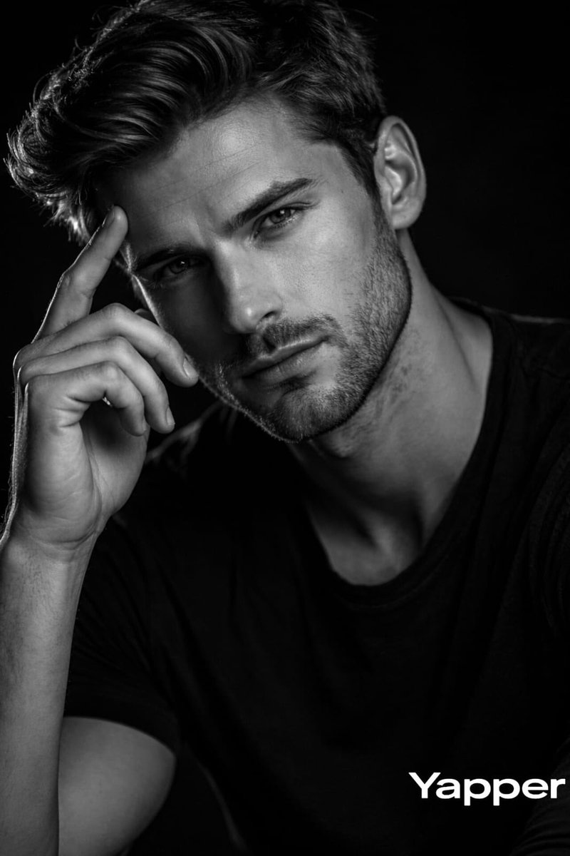 Profile / Avatar - Cinematic Black and White Portrait with Low-Key Lighting — output 1